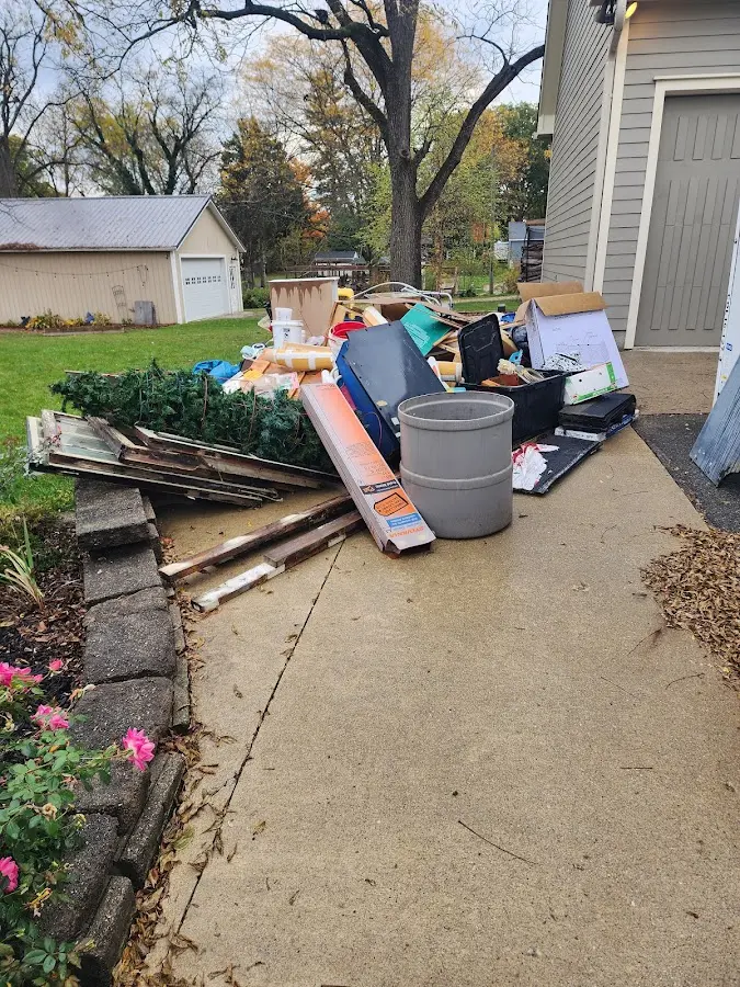 Dumpster being loaded with debris for 3 Yard Dumpster Rental in Hilliard